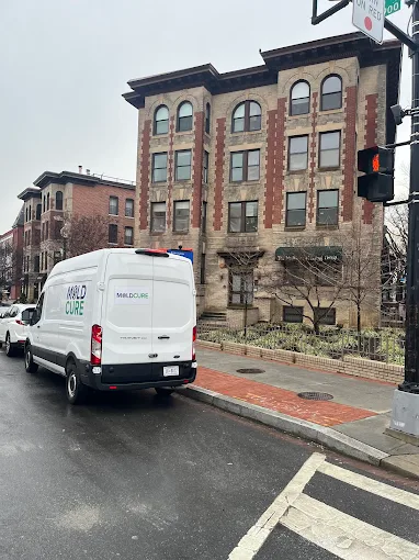 A MoldCure van parked on a Washington, DC street